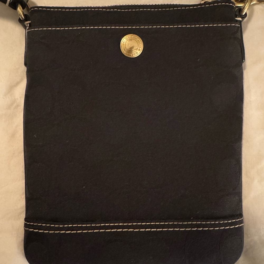 Coach Black Crossbody Bag with Gold Accents, stitching, adjustable strap.